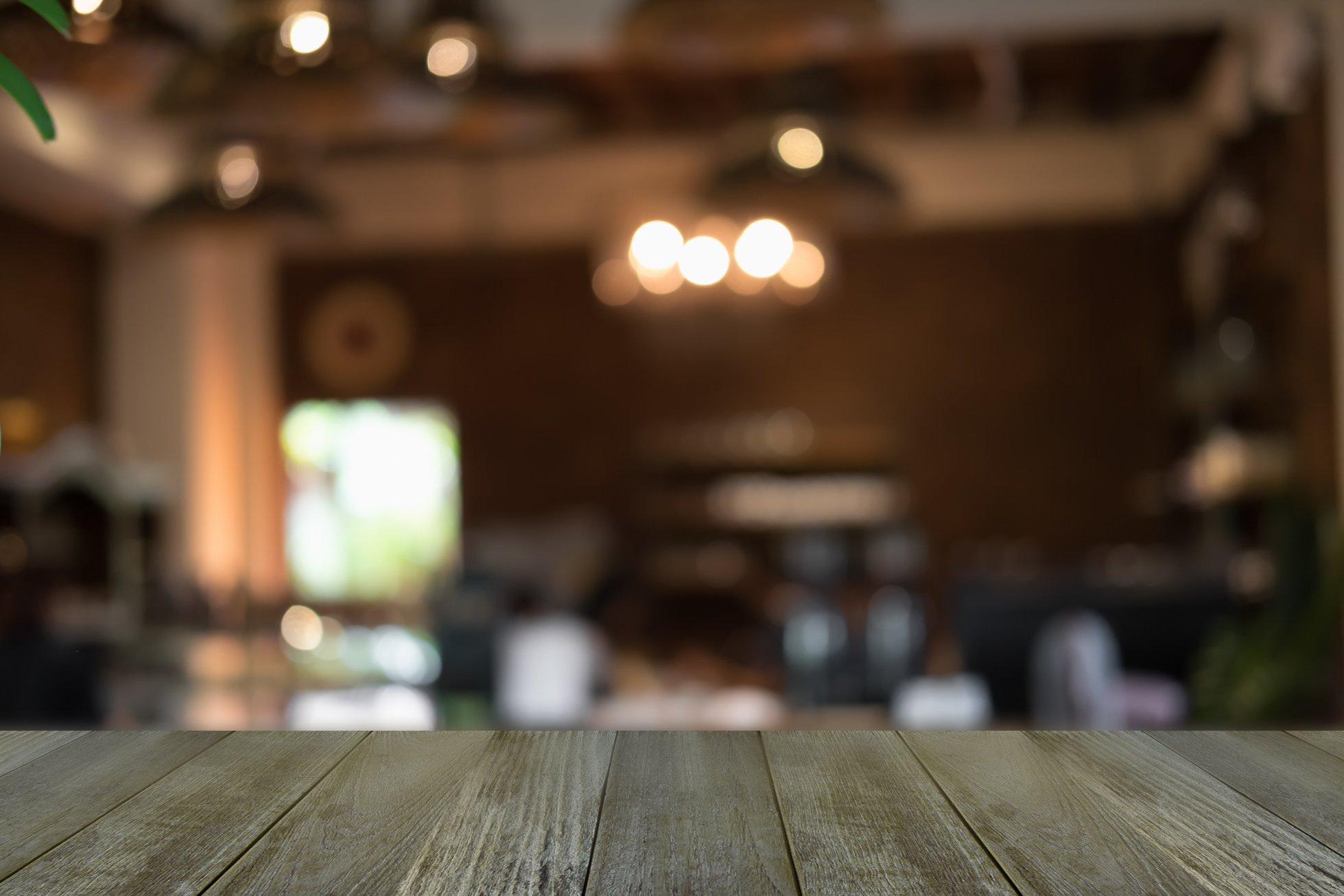 Wooden Table on Blurred Restaurant Interior Background